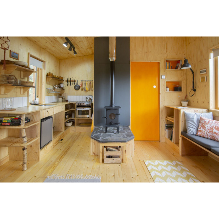 Secluded off-grid cabins nestled in a vibrant forest garden